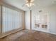 Bedroom showcasing a ceiling fan, blinds on the windows, and a set of French doors leading to another room at 4919 Culdesac Ct, St Cloud, FL 34772