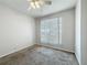 Neutral bedroom featuring a ceiling fan, blinds on the windows, and neutral carpeting at 4919 Culdesac Ct, St Cloud, FL 34772