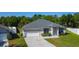 Charming single-Gathering home featuring a two-car garage and manicured landscaping, perfect for suburban living at 4919 Culdesac Ct, St Cloud, FL 34772