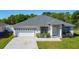 Charming single-Gathering home featuring a two-car garage and manicured landscaping, perfect for suburban living at 4919 Culdesac Ct, St Cloud, FL 34772