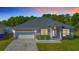 Charming single-Gathering home featuring a two-car garage and manicured landscaping, perfect for suburban living at 4919 Culdesac Ct, St Cloud, FL 34772