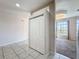 Entryway featuring decorative tile, a coat closet, and a view into the spacious living room at 4919 Culdesac Ct, St Cloud, FL 34772