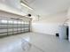 Spacious garage with painted floor, door to exterior, and water heater along the back wall at 4919 Culdesac Ct, St Cloud, FL 34772
