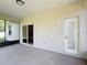 Screened patio with ceiling, sliding glass door to the home, and door to the backyard at 4919 Culdesac Ct, St Cloud, FL 34772