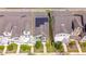 Aerial view of a modern home with solar panels on the roof, situated in a well-manicured neighborhood at 5156 Caspian St, St Cloud, FL 34771