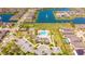 Aerial shot of a community with a large pool, clubhouse, playground, and fountain pond at 5156 Caspian St, St Cloud, FL 34771