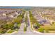 An aerial view of a community featuring beautifully landscaped streets, lush trees and community pool at 5156 Caspian St, St Cloud, FL 34771