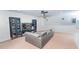 Basement featuring neutral decor, a comfortable sectional sofa, and a media center at 5156 Caspian St, St Cloud, FL 34771