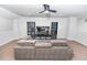Basement featuring neutral decor, a comfortable sectional sofa, and a media center at 5156 Caspian St, St Cloud, FL 34771