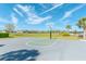 A community basketball court on a manicured lawn with nearby neighborhood homes in the distance at 5156 Caspian St, St Cloud, FL 34771