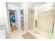 Bathroom with glass-enclosed shower, walk-in closet, and open floor plan offers ample space at 5156 Caspian St, St Cloud, FL 34771