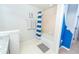 Bathroom with a shower-tub combo offers relaxation, and the adjacent room offers additional living space at 5156 Caspian St, St Cloud, FL 34771