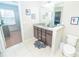 Spacious bathroom featuring double sinks, granite countertops, and ample storage for all your needs at 5156 Caspian St, St Cloud, FL 34771