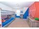 Fun bedroom with bunk beds, playful wall decor, and ample storage for toys and books at 5156 Caspian St, St Cloud, FL 34771