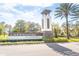 Lakeshore at Narcoossee community sign with palm trees on a sunny day at 5156 Caspian St, St Cloud, FL 34771