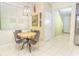 Cozy dining area with a round table and chairs, situated near the kitchen at 5156 Caspian St, St Cloud, FL 34771