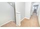 Hallway features carpeted stairs with natural light illuminating the open space at 5156 Caspian St, St Cloud, FL 34771