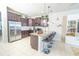 Modern kitchen with stainless steel appliances, granite countertops, and bar stool seating at 5156 Caspian St, St Cloud, FL 34771