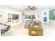 Bright living room featuring stylish seating, a patterned rug, and ample natural light at 5156 Caspian St, St Cloud, FL 34771