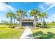 Community mailboxes surrounded by palm trees and landscaping to service residents in a well-maintained neighborhood at 5156 Caspian St, St Cloud, FL 34771