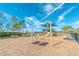 Community playground shaded with a sun sail and featuring swings, slides, and a bench for parents at 5156 Caspian St, St Cloud, FL 34771