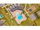 An aerial view of the community pool, playground and recreational center in a well maintained community at 5156 Caspian St, St Cloud, FL 34771