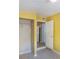 A bright bedroom with a closet, and a doorway that is open to reveal the kitchen at 5424 Blue Grass St, Orlando, FL 32810