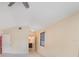 Bright and airy bedroom with vaulted ceiling, tiled flooring, and adjoining bathroom at 5424 Blue Grass St, Orlando, FL 32810