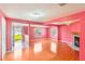Bright living room features wood flooring, a decorative fireplace, and large windows, offering a cozy ambiance at 5424 Blue Grass St, Orlando, FL 32810