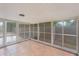 Sunroom with large windows, tiled floors, and access to the outdoors, perfect for relaxation at 5424 Blue Grass St, Orlando, FL 32810