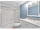 Bathroom features a vanity with marble countertop and a shower-tub combination at 543 Fairways Dr # B, Ocala, FL 34472