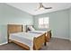 Bedroom showcases twin beds and natural light from the window at 543 Fairways Dr # B, Ocala, FL 34472