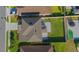 An aerial view shows the property's layout, including a large lawn and patio area, perfect for outdoor living at 5709 Sagunto Dr, Davenport, FL 33897