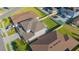 This aerial view highlights a well-manicured lawn and outdoor space with a patio and convenient street access at 5709 Sagunto Dr, Davenport, FL 33897