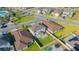 Aerial view of the backyard featuring a paver patio, manicured lawn, and surrounded by a privacy fence at 5709 Sagunto Dr, Davenport, FL 33897