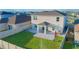 View of a spacious backyard with a paver patio, lush lawn, and privacy fence, perfect for outdoor entertaining at 5709 Sagunto Dr, Davenport, FL 33897