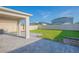 Large backyard featuring green grass, a paved patio, and a privacy fence for outdoor enjoyment at 5709 Sagunto Dr, Davenport, FL 33897