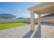 Spacious backyard with a well-maintained lawn, a paver patio, and a white privacy fence at 5709 Sagunto Dr, Davenport, FL 33897