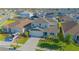 Charming two-story home featuring a two-car garage, well-manicured lawn, and a welcoming front entrance at 5709 Sagunto Dr, Davenport, FL 33897