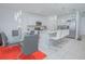 Bright, open kitchen featuring stainless steel appliances, white countertops, and eat-in dining area at 5709 Sagunto Dr, Davenport, FL 33897