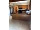 Kitchen featuring wood cabinets, black countertops, and a large island at 6 Barnard Ct, Maitland, FL 32751