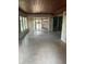 Bright living room features wood ceiling and glass doors to outdoor living space at 6 Barnard Ct, Maitland, FL 32751