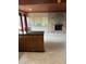 Living room with wood ceilings, brick fireplace and large windows with curtains at 6 Barnard Ct, Maitland, FL 32751