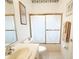 Cozy bathroom with a tub shower and a white sink vanity at 603 Russ Pond Dr, Kissimmee, FL 34759
