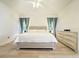 Bright bedroom featuring wood floors, neutral walls, and a ceiling fan at 603 Russ Pond Dr, Kissimmee, FL 34759