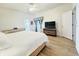 Bright bedroom with wooden floors and neutral decor at 603 Russ Pond Dr, Kissimmee, FL 34759