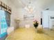Bright dining room featuring decorative chandelier, tile floors, and neutral paint at 603 Russ Pond Dr, Kissimmee, FL 34759