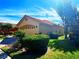 Well-maintained home featuring a tile roof and manicured landscaping at 603 Russ Pond Dr, Kissimmee, FL 34759