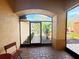 View from screened entry porch out to manicured landscaping at 603 Russ Pond Dr, Kissimmee, FL 34759