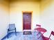 Covered front porch with seating area and brick flooring at 603 Russ Pond Dr, Kissimmee, FL 34759